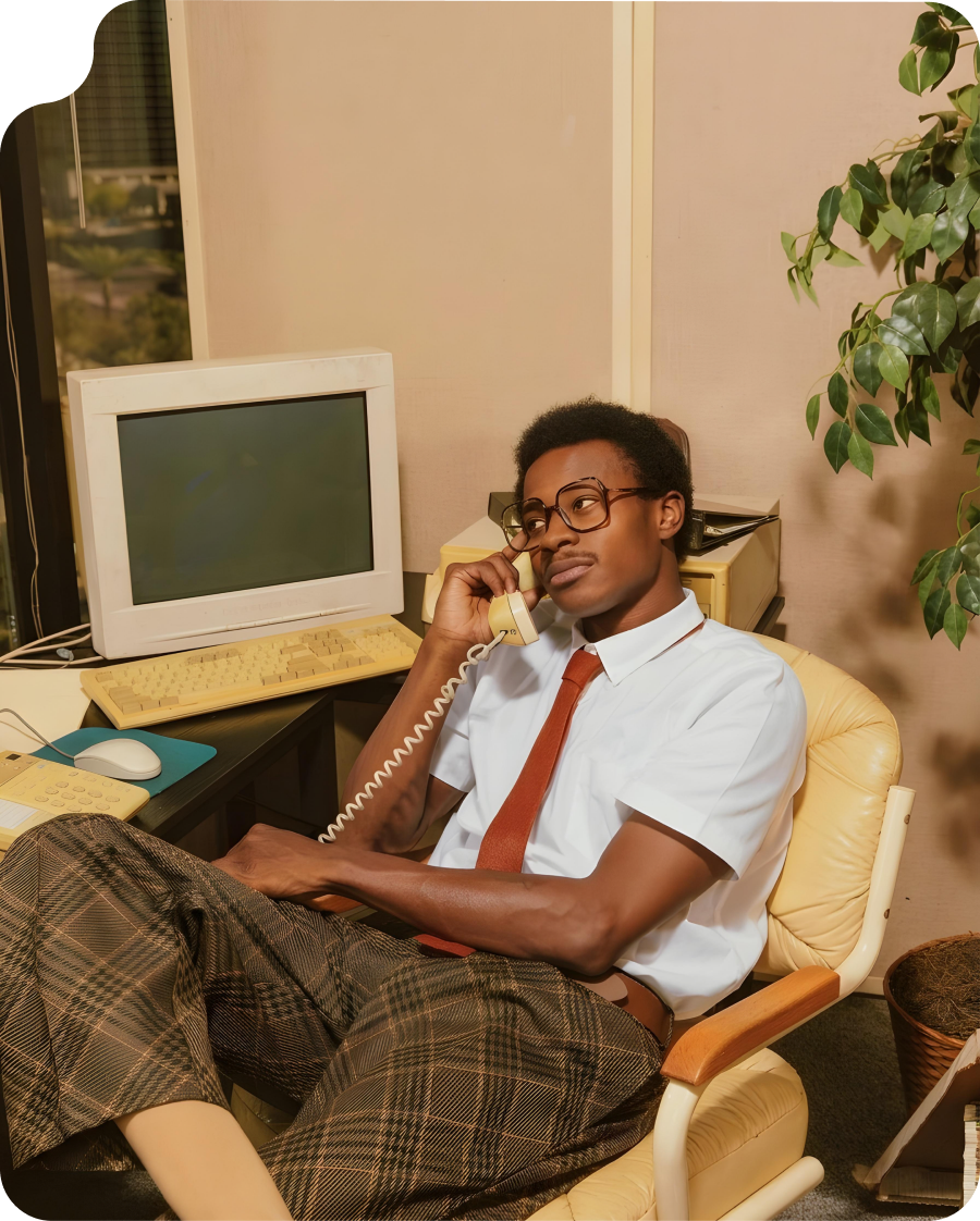 Person on a phone call at a vintage office setup